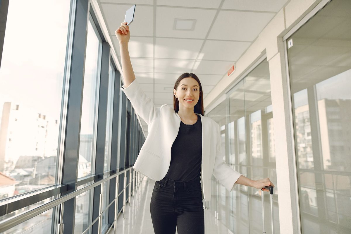 Seoul medical tourism itinerary — woman walking through modern airport terminal post-treatment