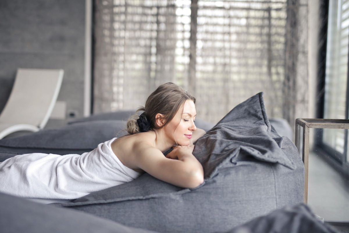 Bright, airy hotel room with floor-to-ceiling windows and natural light — ideal recovery environment